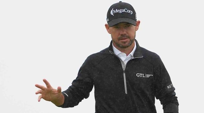 Brian Harman acknowledges the crowd after a putt on the 14th green during the final round of the 2023 British Open.